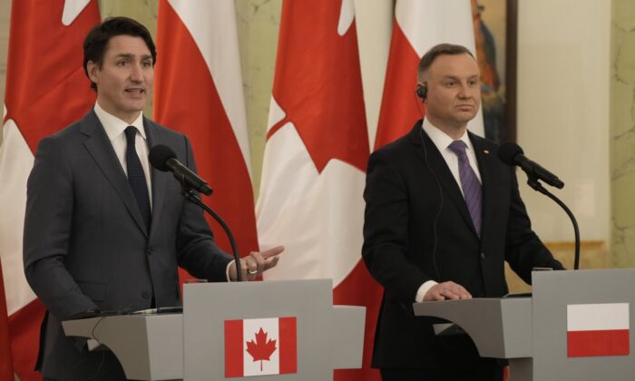 Prime Minister Justin Trudeau, left, talks to journalists during a joint press conference with Poland's President Andrzej Duda on the occasion of their meeting at Belwelder Palace, in Warsaw, Poland, March 10, 2022. (The Canadian Press/AP-Czarek Sokolowski)