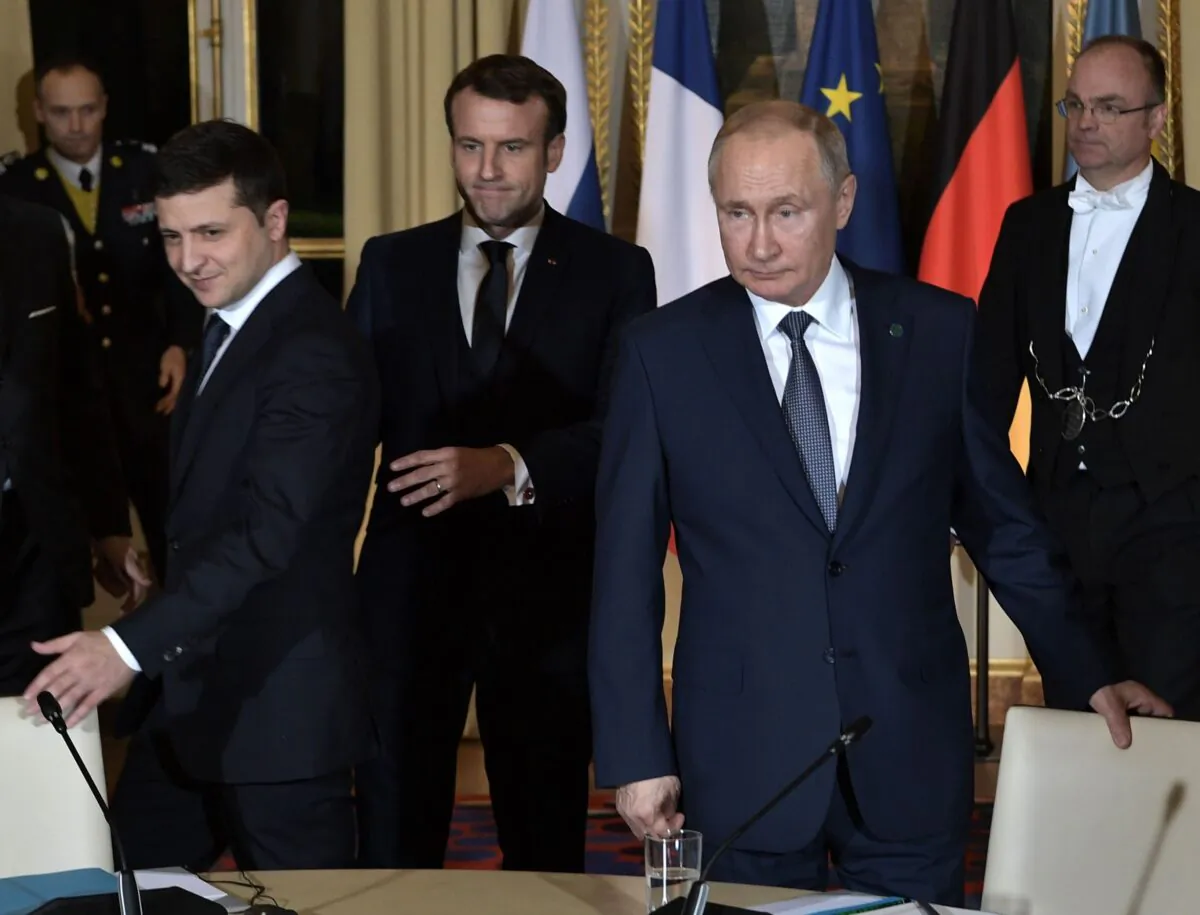 Ukrainian President Volodymyr Zelenskyy (L), French President Emmanuel Macron (C) and Russian President Vladimir Putin (R) arrive for a meeting on Ukraine with German Chancellor at the Elysee Palace in Paris, on Dec. 9, 2019. (Alexey Nikolsky/Sputnik/AFP via Getty Images)