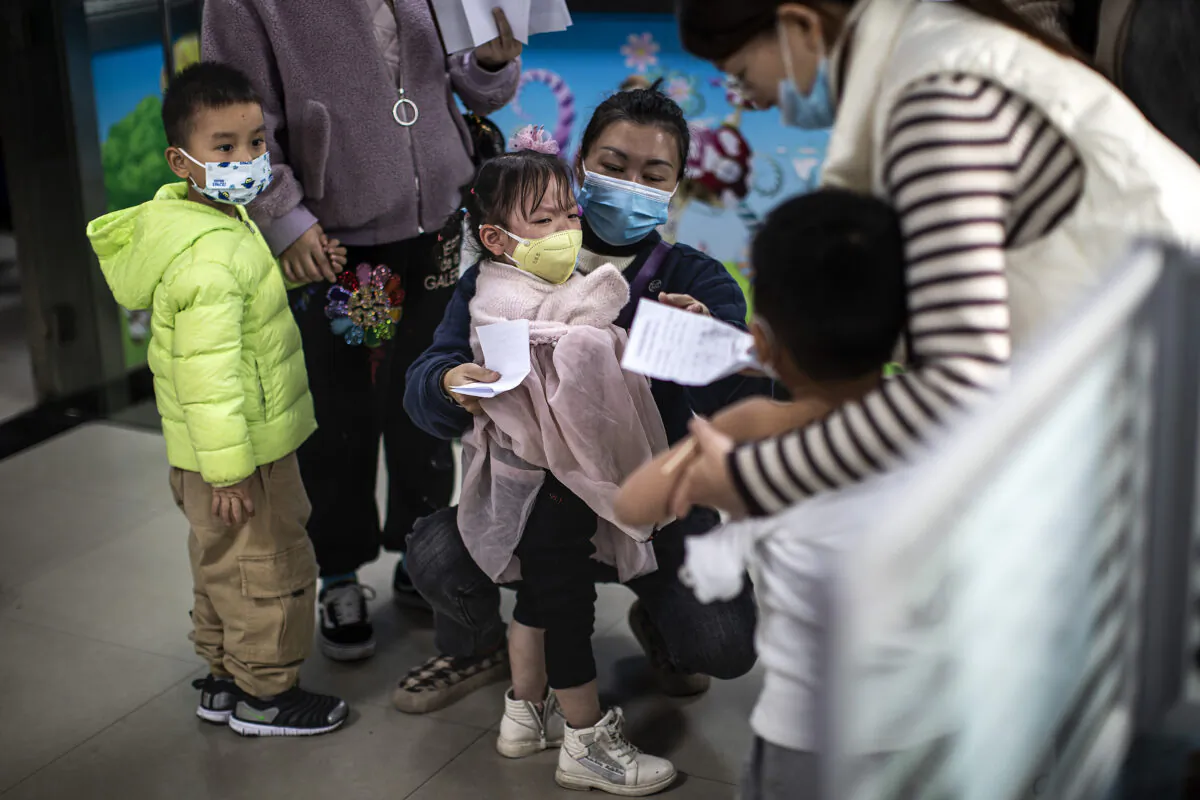 Children prepare to receive a vaccine against COVID-19 at a vaccination site in Wuhan, Hubei Province, China, on Nov. 18, 2021. (Getty Images)