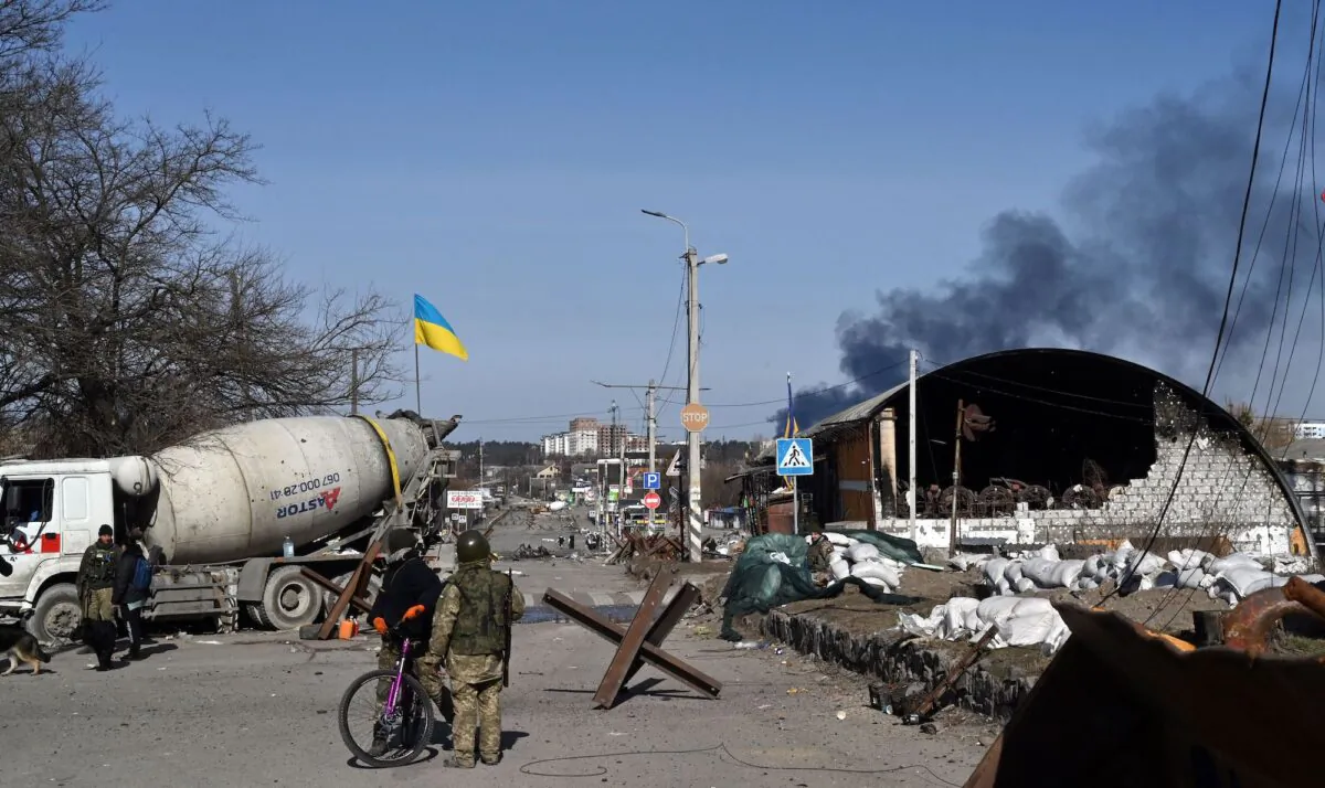 Ukrainian soldiers are on guard in Irpin, north of Kyiv, on March 12, 2022. (Sergei Supinsky /AFP via Getty Images)