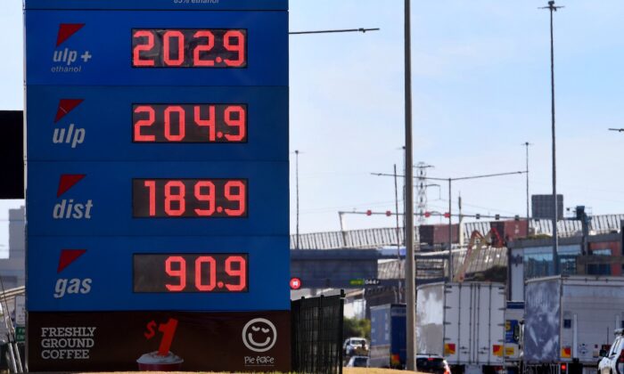 A sign outside a petrol station shows the price of petrol breaking through the two Australian dollar (1.46 USD) a litre mark in Melbourne, Victoria, on March 3, 2022. (William West/AFP via Getty Images)