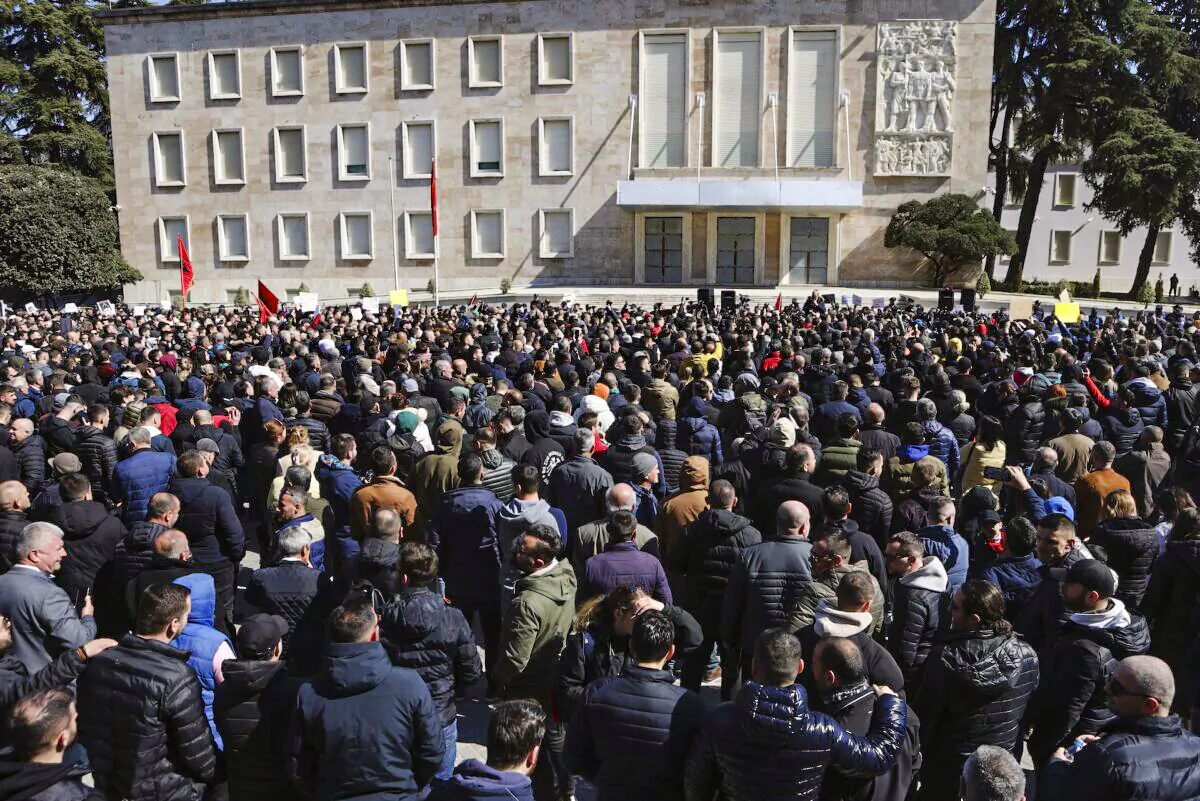 Protesters gather outside the prime minister's office during a rally in Tirana, Albania, on March 12, 2022. (Franc Zhurda/AP Photo)