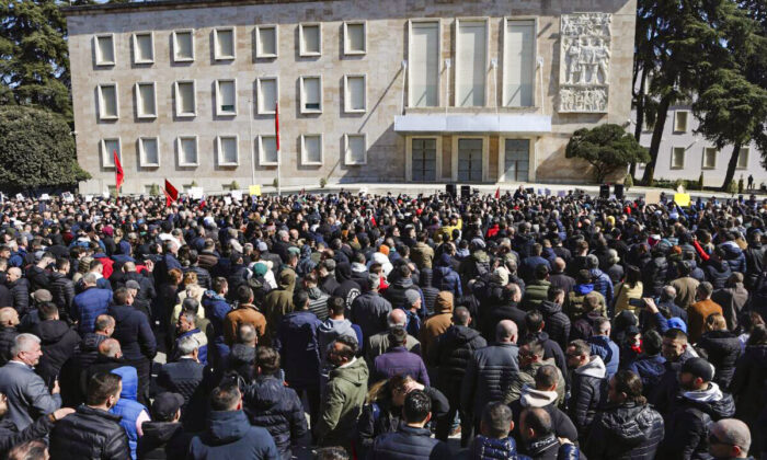 Protesters gather outside the prime minister's office during a rally in Tirana, Albania, on March 12, 2022. (Franc Zhurda/AP Photo)