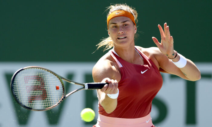 Aryna Sabalenka of Belarus returns a shot to Jasmine Paolini of Italy during the BNP Paribas Open at the Indian Wells Tennis Garden in Indian Wells, Calif., on March 12, 2022. (Matthew Stockman/Getty Images)