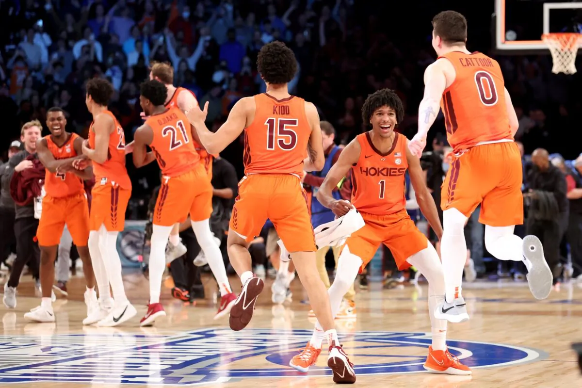 Virginia Tech Hokies forward David N'Guessan (1) celebrates with center Lynn Kidd (15) and guard Hunter Cattoor (0) after defeating the Duke Blue Devils 82-67 in the ACC Men's Basketball Tournament final at Barclays Center in Brooklyn, New York, on March 12, 2022. (Brad Penner/USA TODAY Sports via Field Level Media)