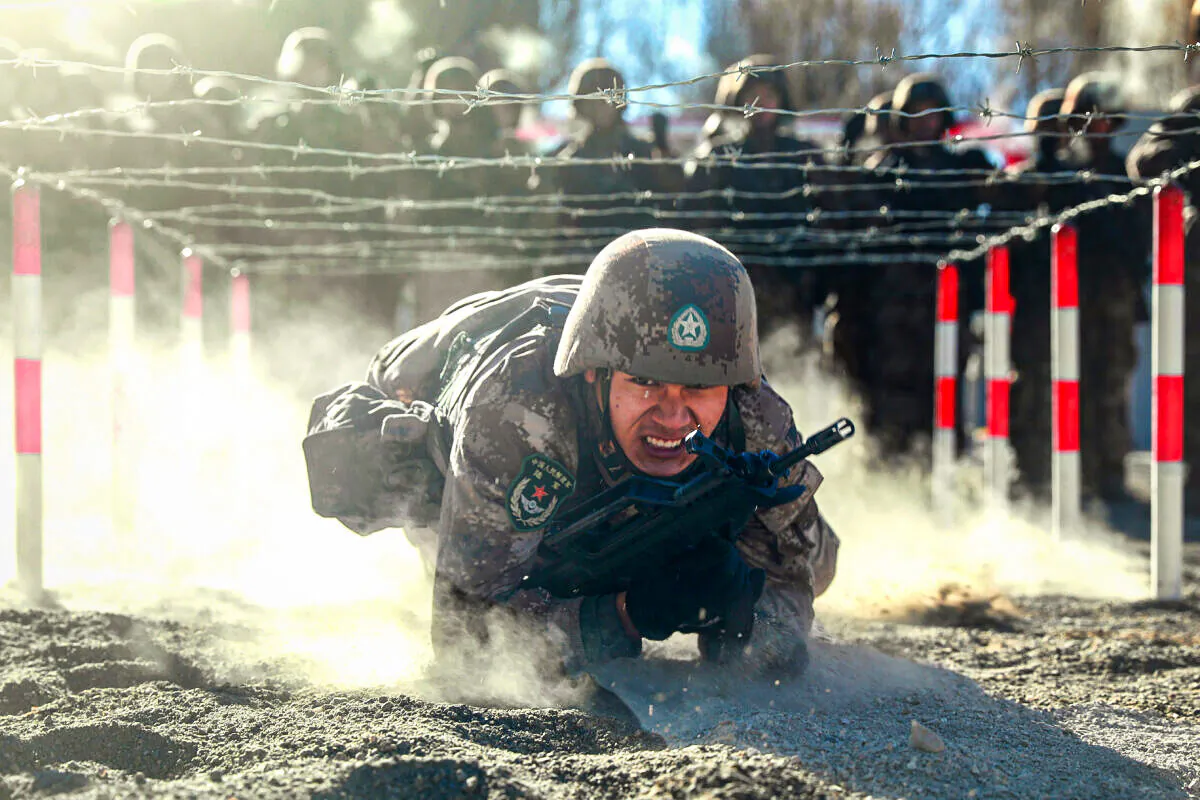 Chinese soldiers taking part in military training at Pamir Mountains in Kashgar, northwestern China's Xinjiang region on Jan. 4, 2021. (STR/AFP via Getty Images)