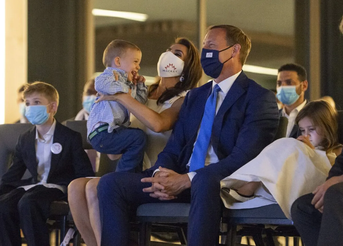 Peter MacKay, leadership candidate for the Conservative Party of Canada, and his wife Nazanin Afshin-Jam MacKay watch a broadcast show that will announce the party's new leader with their children Kian, 7, Valentia, 4, and Caledon, 2, in Ottawa on Aug. 23, 2020. (The Canadian Press/Justin Tang)