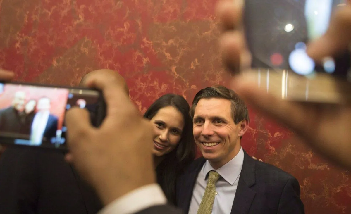 Brampton Mayor Patrick Brown poses for a photo for a supporter alongside his wife Genevieve Gualtieri after winning the Brampton Mayoral Election during a campaign celebration in Brampton, Ont., on Oct. 22, 2018. (The Canadian Press/Chris Young)