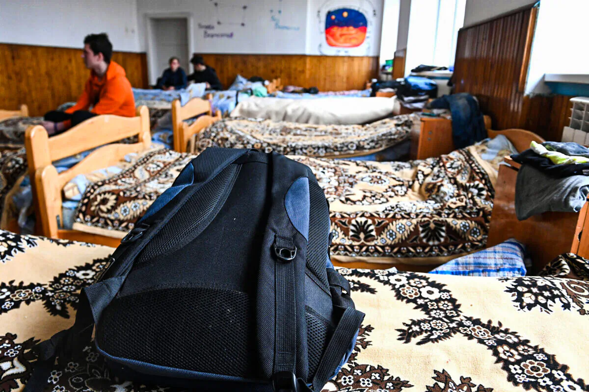 Boys in a dormitory in a school in Perekhrestya, Ukraine, near the Hungarian border on March 7, 2022, a refuge for 93 orphaned children evacuated from the Artek childrens camp near Kyiv a few days ago due to the Russian invasion. (ATTILA KISBENEDEK/AFP via Getty Images)