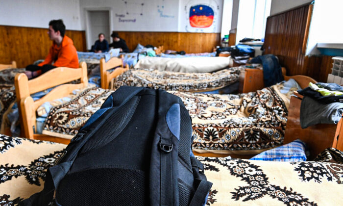 Boys in a dormitory in a school in Perekhrestya, Ukraine, near the Hungarian border on March 7, 2022, a refuge for 93 orphaned children evacuated from the Artek childrens camp near Kyiv a few days ago due to the Russian invasion. (ATTILA KISBENEDEK/AFP via Getty Images)