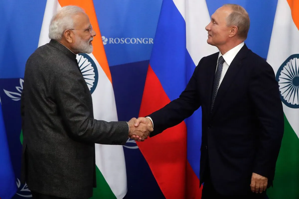 Russian President Vladimir Putin (R) shakes hands with Indian Prime Minister Narendra Modi during a joint news conference before the Eastern Economic Forum in Vladivostok, Russia, on Sept. 4, 2019. (Mikhail Metzel/AFP via Getty Images)