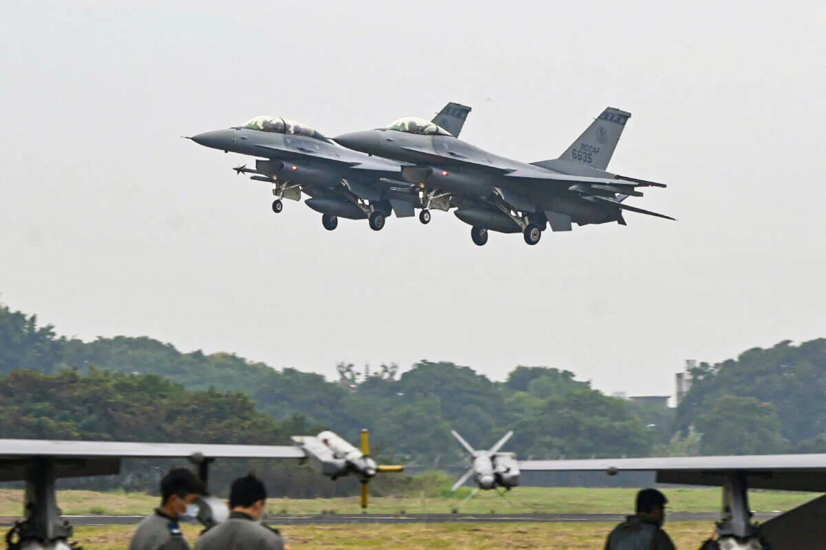 Two armed F-16V fighter jets fly over an air force base in Chiayi, southern Taiwan, on Jan. 5, 2022. (Sam Yeh/AFP via Getty Images)