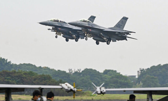 Two armed U.S.-made F-16V fighters fly over an air force base in Chiayi, Taiwan, on Jan. 5, 2022. (Sam Yeh/AFP via Getty Images)