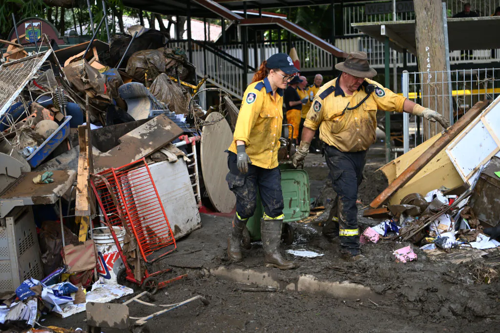 Volunteers from the local Rural Fire Brigade help to clean up a flood-affected primary school in Tumbulgum, Australia, on March 6, 2022. (Dan Peled/Getty Images)