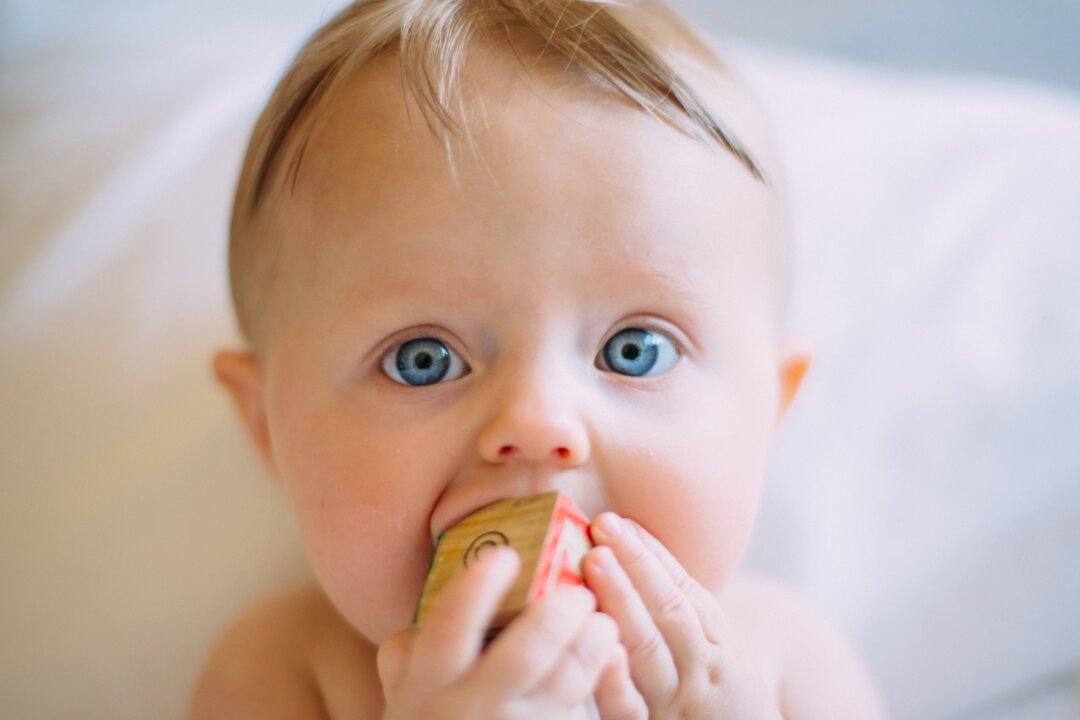 Babies show a preference for faces over other objects. (Photo by Colin Maynard on Unsplash)
