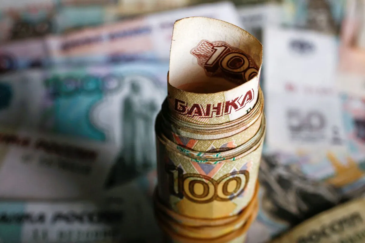 A picture illustration shows rolled Russian rouble banknotes on a table in Warsaw, Poland, on Jan. 22, 2016. (Kacper Pempel/Reuters)