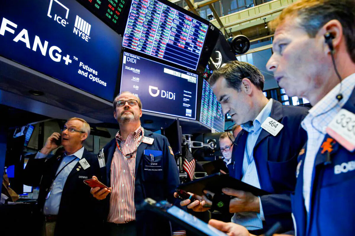 Traders work during the IPO for Chinese ride-hailing company Didi Global Inc. on the New York Stock Exchange (NYSE) floor in New York City on June 30, 2021. (Brendan McDermid/Reuters)