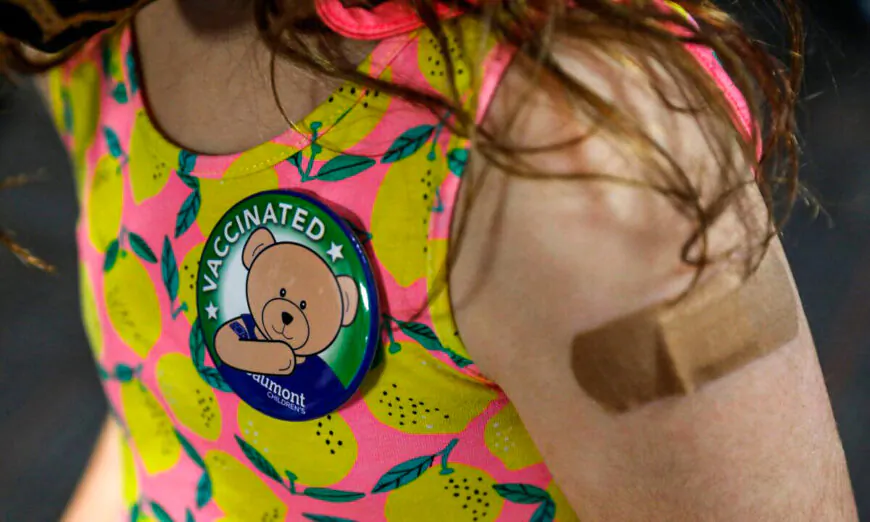 A child wears a pin she received after receiving her first dose of the Pfizer COVID-19 vaccine in Southfield, Mich., on Nov. 5, 2021. (Jeff Kowalsky/AFP via Getty Images)