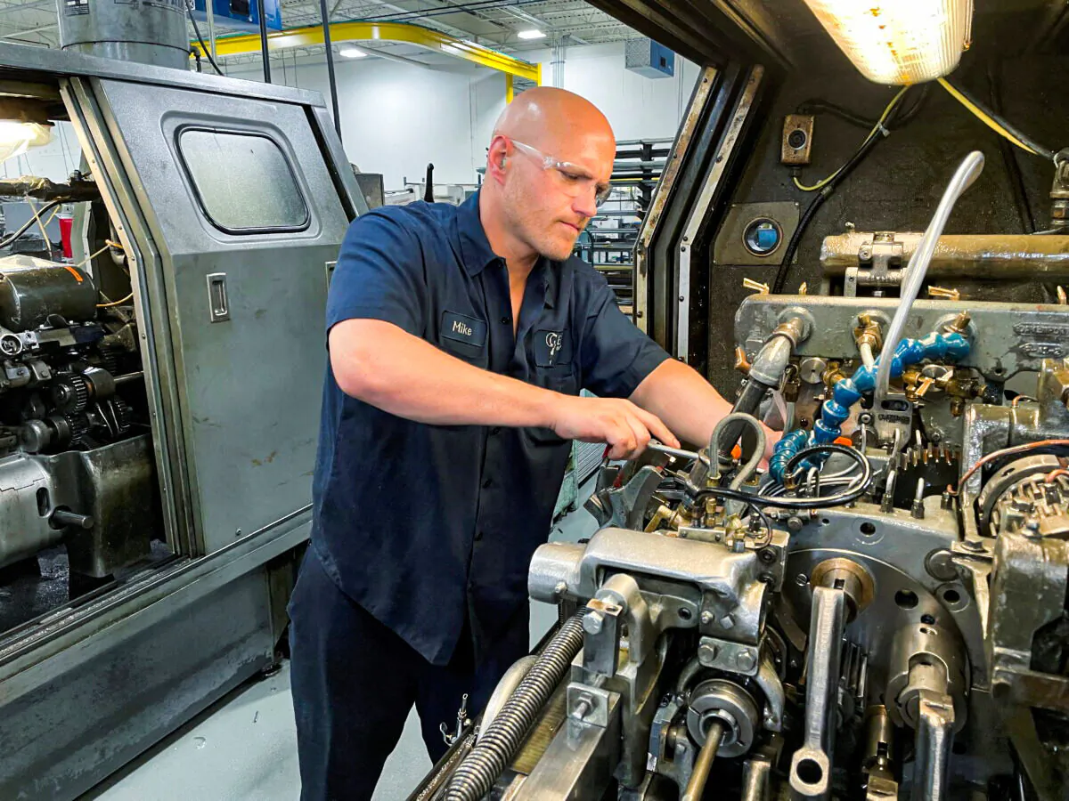 A worker operates a metal cutting machines at Gent Machine Co.'s factory in Cleveland on May 26, 2021. (Timothy Aeppel/Reuters)