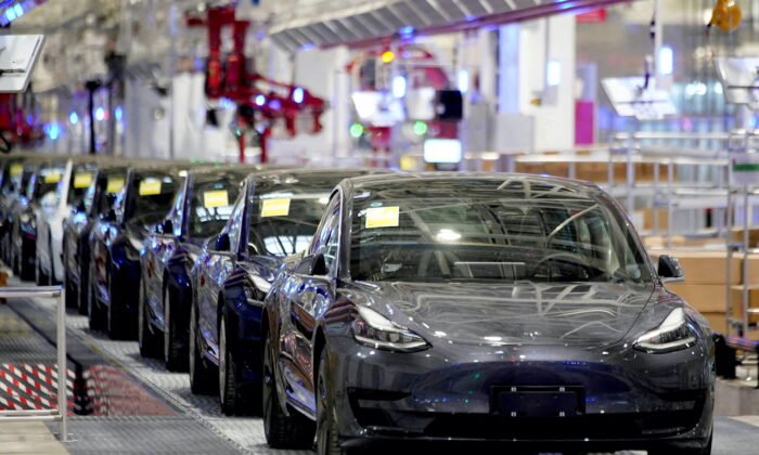 Tesla's China-made Model 3 vehicles are seen during a delivery event at its factory in Shanghai, on Jan. 7, 2020. (Aly Song/Reuters)