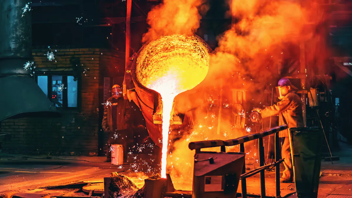 Molten iron poured into a cast at a steel factory. (DedMityay/Adobe Stock)