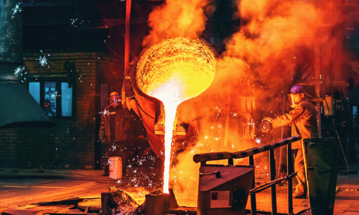 Molten iron poured into a cast at a steel factory. (DedMityay/Adobe Stock)