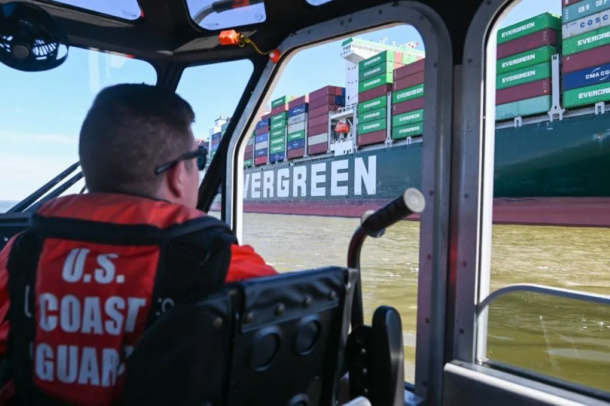 A response boat crew from Coast Guard Station Curtis Bay monitors the 1,095-foot motor vessel Ever Forward, which became grounded in the Chesapeake Bay on March 13, 2022.  (U.S. Coast Guard photo by Petty Officer 3rd Class Kimberly Reaves/Released)