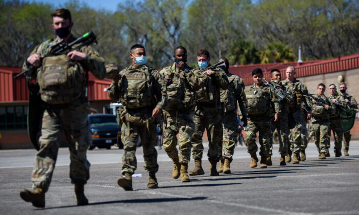 Members of the 1st Armored Brigade Combat Team, 3rd Battalion, 69th Armored Regiment deploy to Germany on March 2, 2022 in Savannah, Georgia. (Melissa Sue Gerrits/Getty Images)