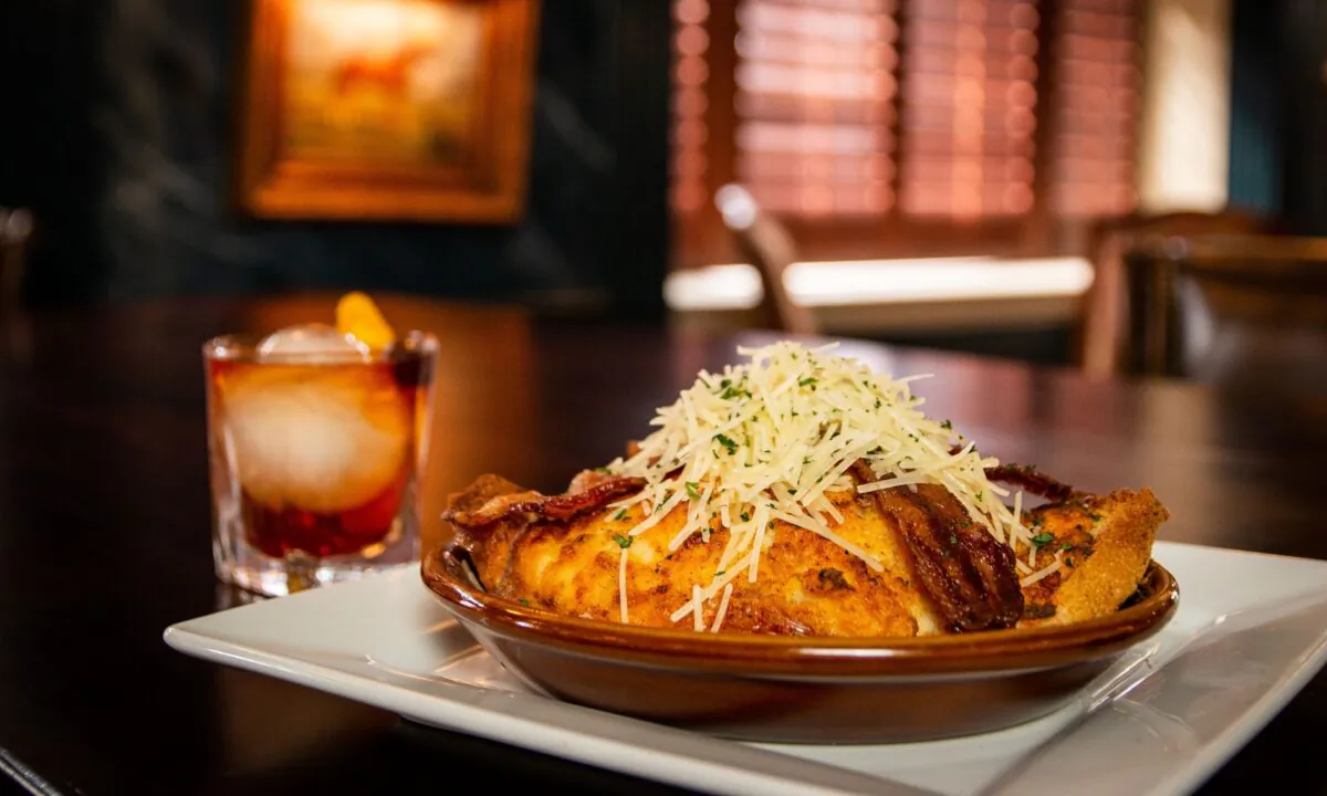 At the Brown Hotel, their famous open-faced sandwich is broiled until golden and gooey, and arrives at the table bubbling hot in a ceramic skillet, ready to be devoured. (Courtesy of the Brown Hotel)