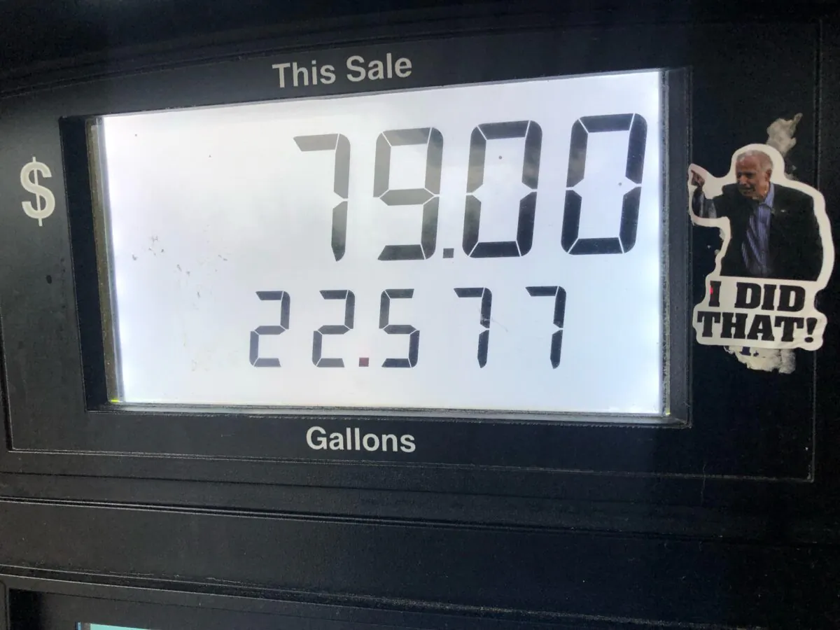 Gas station employees in Gainesville, Fla. say they keep removing stickers from gas pumps that show President Joe Biden with the words, "I did that!" but replacement stickers quickly reappear. (Nanette Holt/Epoch Times)