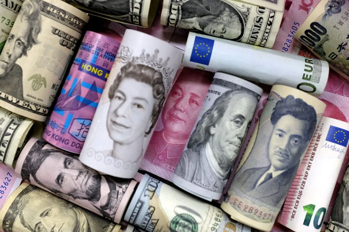 Euro, Hong Kong dollar, U.S. dollar, Japanese yen, pound and Chinese 100 yuan banknotes in this picture illustration on Jan. 21, 2016. (Jason Lee/Illustration/Reuters)
