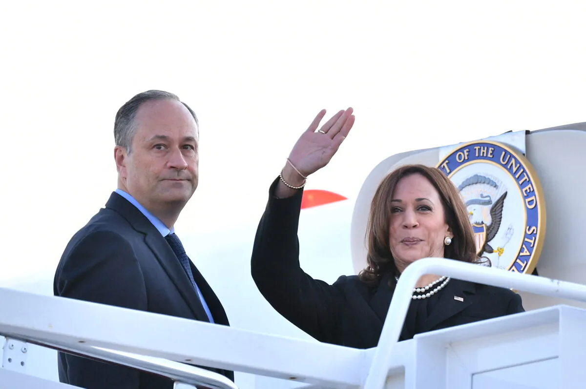 U.S. Vice President Kamala Harris (R) and her husband Doug Emhoff (L) about to  board a flight before departing from Andrews Air Force Base in Maryland on Sept. 11, 2021. (Mandel Ngan/AFP via Getty Images)