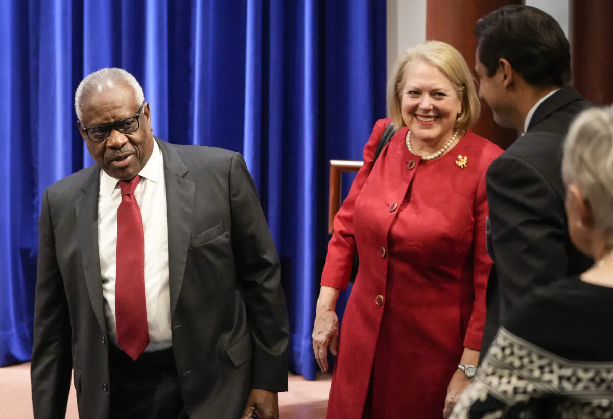 Associate Supreme Court Justice Clarence Thomas and his wife, conservative activist Virginia Thomas, arrive at the Heritage Foundation in Washington on Oct. 21, 2021. (Drew Angerer/Getty Images)