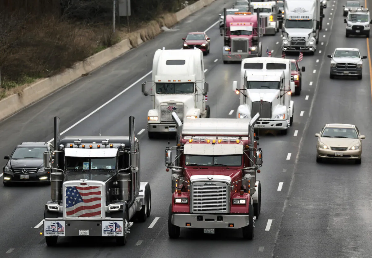 Trucks drive alongside each other as they participate in The People's Convoy on the Capitol Beltway in Bethesda, Maryland, on March 7, 2022. (Kevin Dietsch/Getty Images)