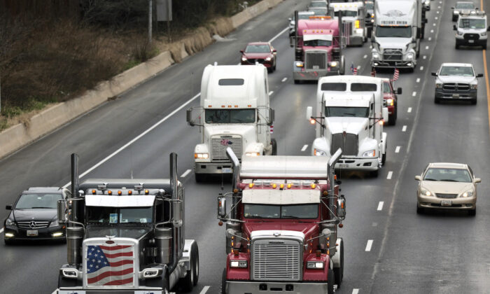 Trucks drive alongside each other as they participate in The People's Convoy on the Capitol Beltway in Bethesda, Maryland, on March 7, 2022. (Kevin Dietsch/Getty Images)