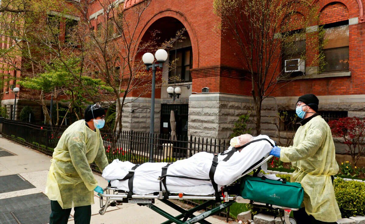 Emergency Medical Technicians (EMTs) wheel a man out of the Cobble Hill Health Center nursing home during an outbreak of COVID-19 in the Brooklyn borough of New York City on April 17, 2020. (Lucas Jackson/Reuters)