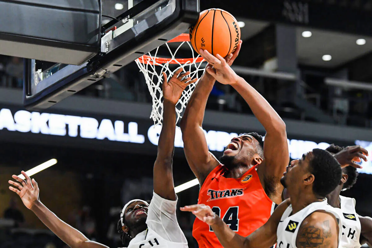 E.J. Anosike #24 of the Cal State Fullerton Titans grabs a rebound against Long Beach State during the championship game of the Big West Conference basketball tournament in Henderson, Nevada in March 12, 2022. The Titans won the game 72-71. (Sam Morris/Getty Images)
