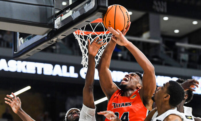 E.J. Anosike #24 of the Cal State Fullerton Titans grabs a rebound against Long Beach State during the championship game of the Big West Conference basketball tournament in Henderson, Nevada in March 12, 2022. The Titans won the game 72-71. (Sam Morris/Getty Images)