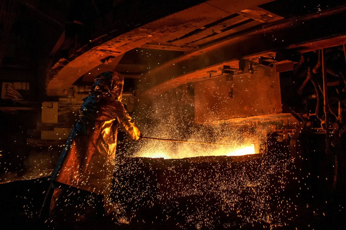 A worker mans a furnace during the nickel smelting process at Indonesian mining company PT Vale's smelting plant in Soroako, South Sulawesi, on March 30, 2019 . (Bannu Mazandra/AFP via Getty Images)