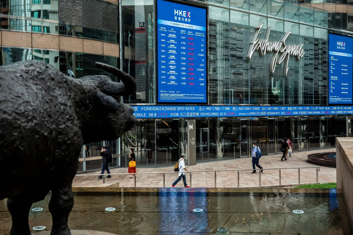 Electronic boards display various stock prices at Exchange Square in Hong Kong on March 9, 2020.  (Isaac Lawrence/AFP via Getty Images)