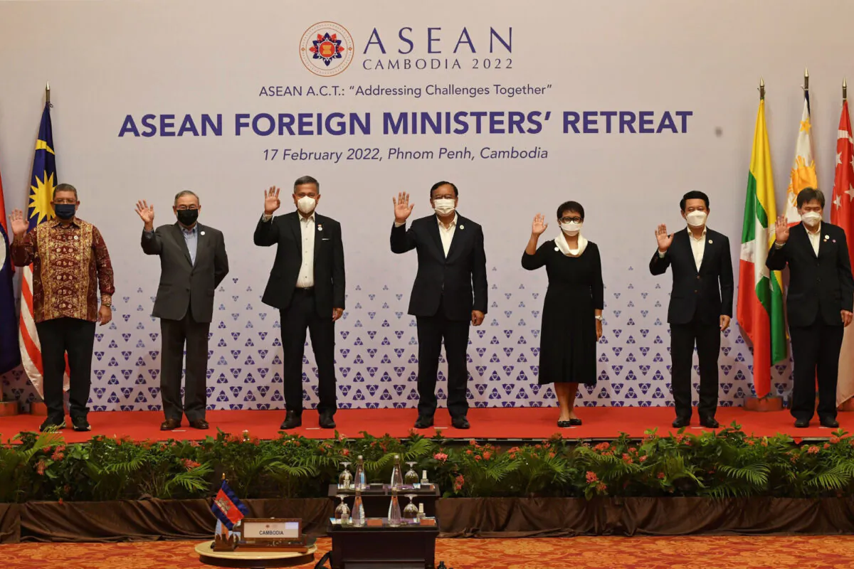 Foreign ministers of the Association of Southeast Asian Nations (ASEAN) from L-R:
Malaysia's Saifuddin Abdullah, Philippines' Teodoro Locsin, Singapore's Vivian Balakrishnan, Cambodia's Prak Sokhonn, Indonesia's Retno Marsudi, Laos' Saleumxay Kommasith and ASEAN Secretary-General Lim Jock Hoi pose for a group photo during the ASEAN Foreign Ministers' Retreat in Phnom Penh on Feb. 17, 2022. (Tang Chhin Sothy / AFP via Getty Images)