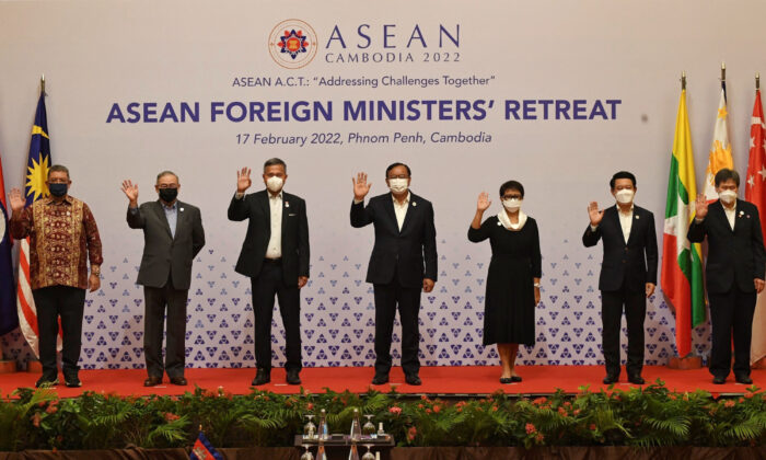 Foreign ministers of the Association of Southeast Asian Nations (ASEAN) from L-R:
Malaysia's Saifuddin Abdullah, Philippines' Teodoro Locsin, Singapore's Vivian Balakrishnan, Cambodia's Prak Sokhonn, Indonesia's Retno Marsudi, Laos' Saleumxay Kommasith and ASEAN Secretary-General Lim Jock Hoi pose for a group photo during the ASEAN Foreign Ministers' Retreat in Phnom Penh on Feb. 17, 2022. (Tang Chhin Sothy / AFP via Getty Images)