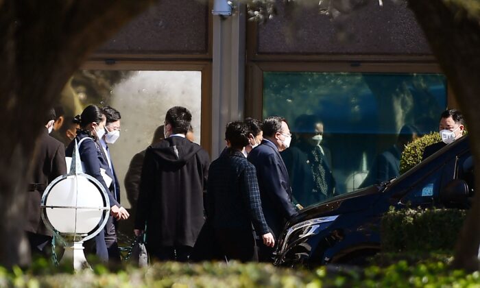 Members of the Chinese diplomatic delegation leave the Cavalieri Waldorf Astoria hotel, where U.S. National Security Adviser Jake Sullivan met with senior Chinese Communist Party diplomat Yang Jiechi, in Rome, on March 14, 2022. (Filippo Monteforte/AFP via Getty Images)