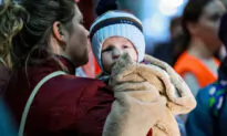 At Ukraine Train Station, Some Mothers Wait to Flee, Others Return Home