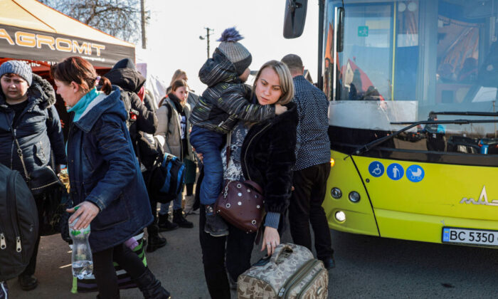 Ukrainians who have fled their homes reach the border crossing into Medyka, Poland, from western Ukraine, on March 14, 2022. (Charlotte Cuthbertson/The Epoch Times)