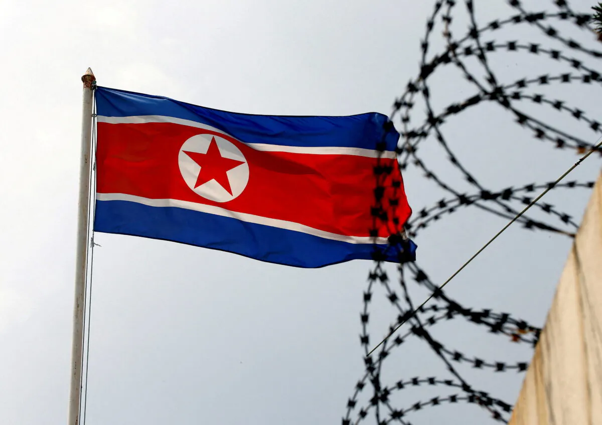 A North Korea flag flutters next to concertina wire at the North Korean embassy in Kuala Lumpur, Malaysia, on March 9, 2017. (Edgar Su/Reuters)