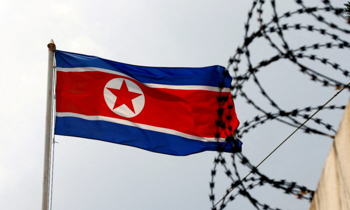 A North Korea flag flutters next to concertina wire at the North Korean embassy in Kuala Lumpur, Malaysia, on March 9, 2017. (Edgar Su/Reuters)