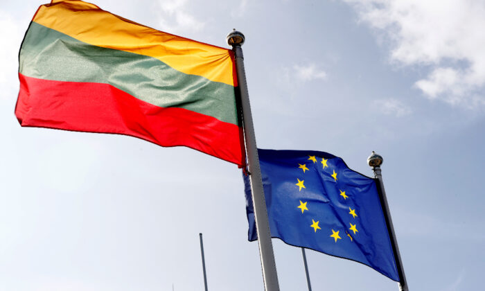 European Union and Lithuanian flags flutter at border crossing point in Medininkai, Lithuania, on Sep. 18, 2020. (Ints Kalnins/Reuters)