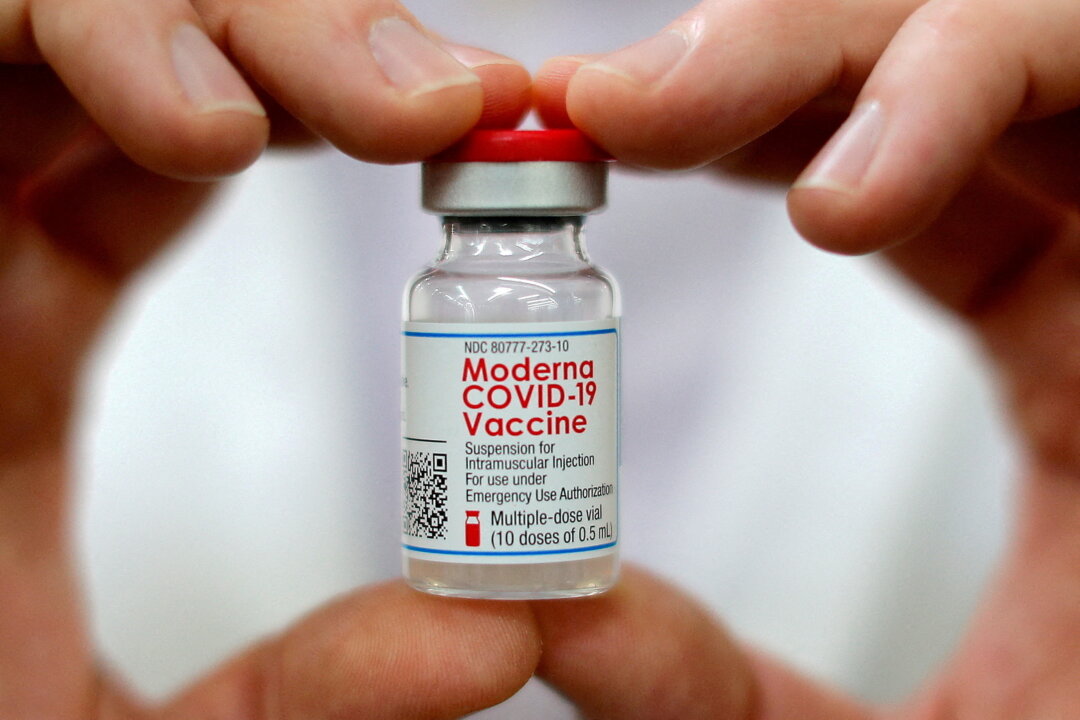 A pharmacist holds a vial of the Moderna COVID-19 vaccine in West Haven, Connecticut, on Feb. 17, 2021. (Mike Segar/Reuters)