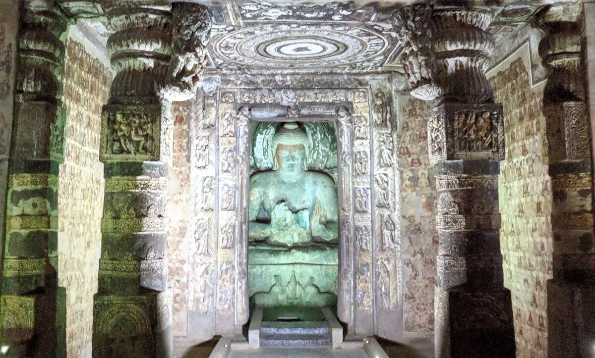 A statue of the Buddha sits inside the sanctum sanctorum of one of the most visited caves at Ajanta (Photographed by Vengolis) 
